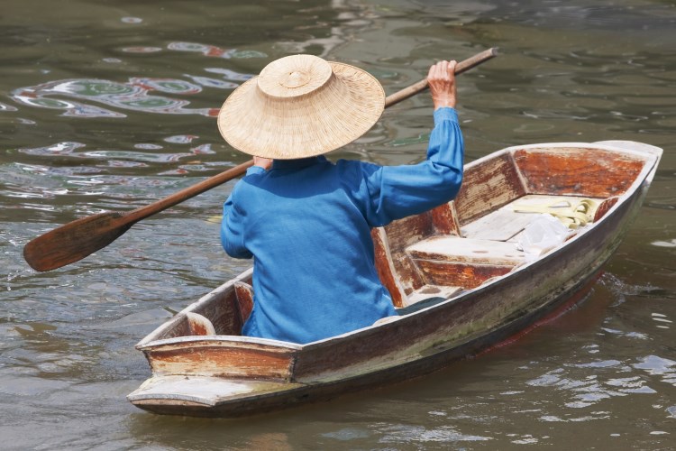 Woman rowing north